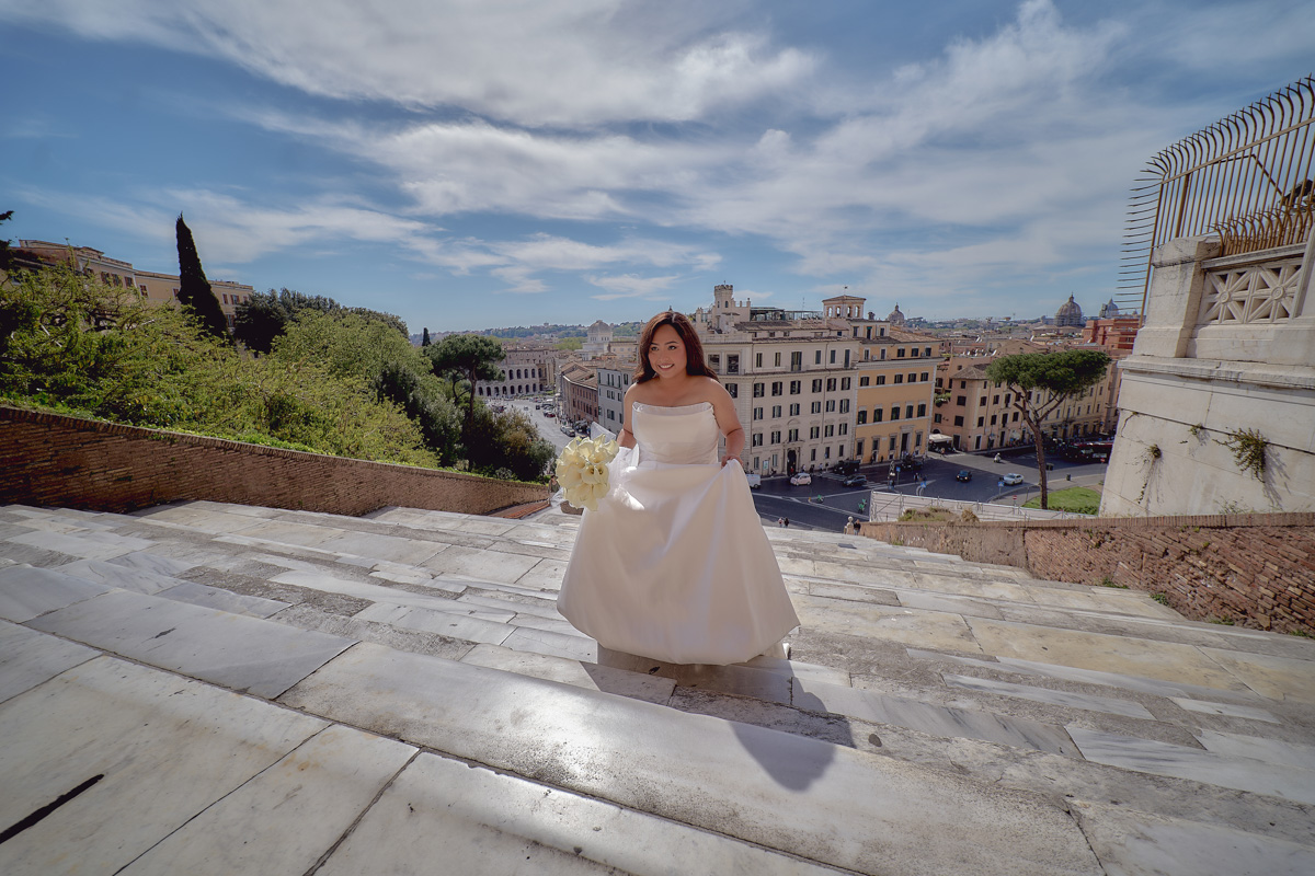 Bride walking up the last steps of S. Maria in Aracoeli