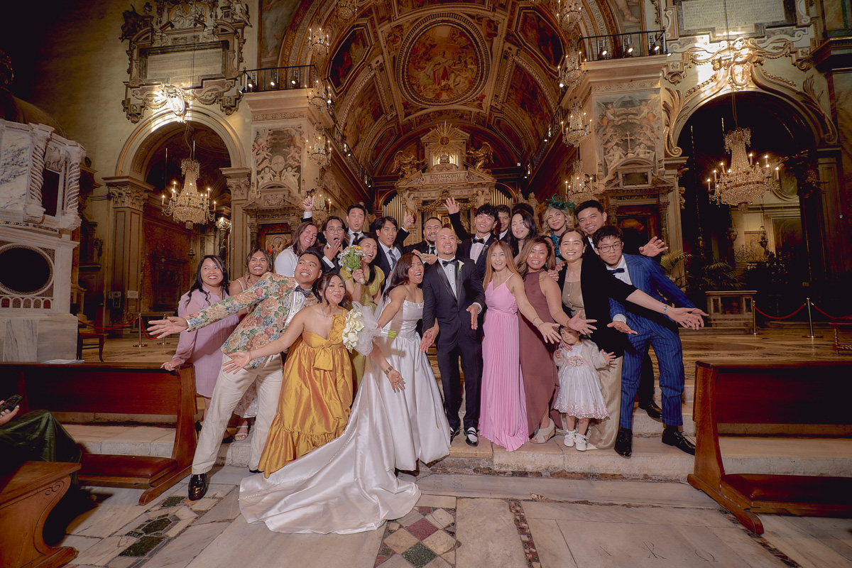 Group picture of newlyweds and guests after wedding at S. Maria in Aracoeli in Rome