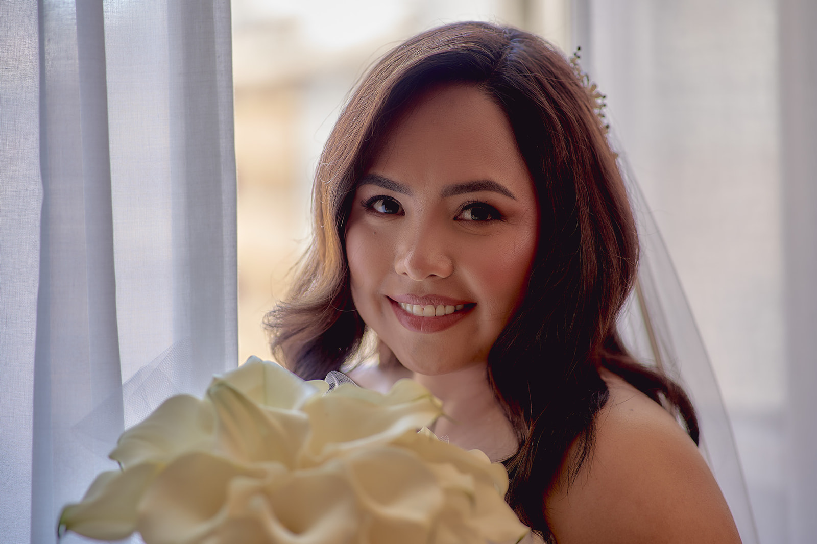 Portrait of bride holding bouquet in Rome hotel
