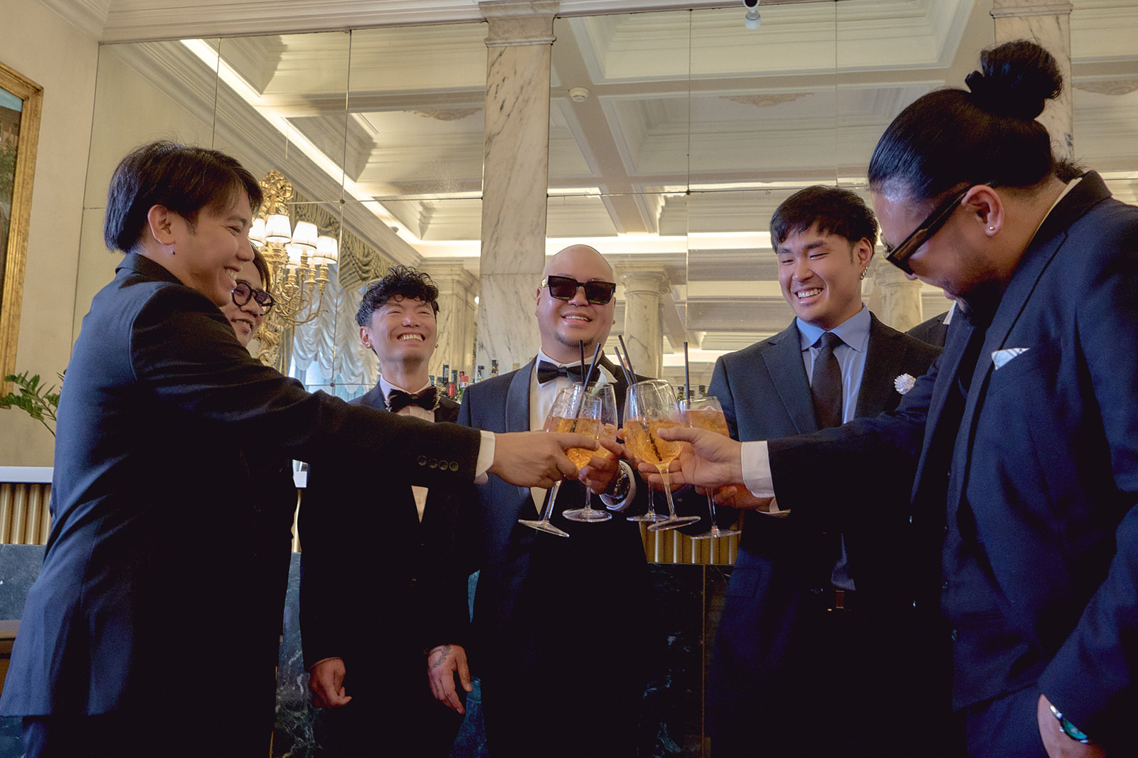 Groom and groomsmen toast at hotel in Rome